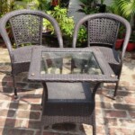 Enjoy the sun-kissed bliss on our rooftop garden with comfortable chairs and a table to sunbathe at the best homestay in Delhi. Chairs and Table for Sunbathing on the Roof Garden